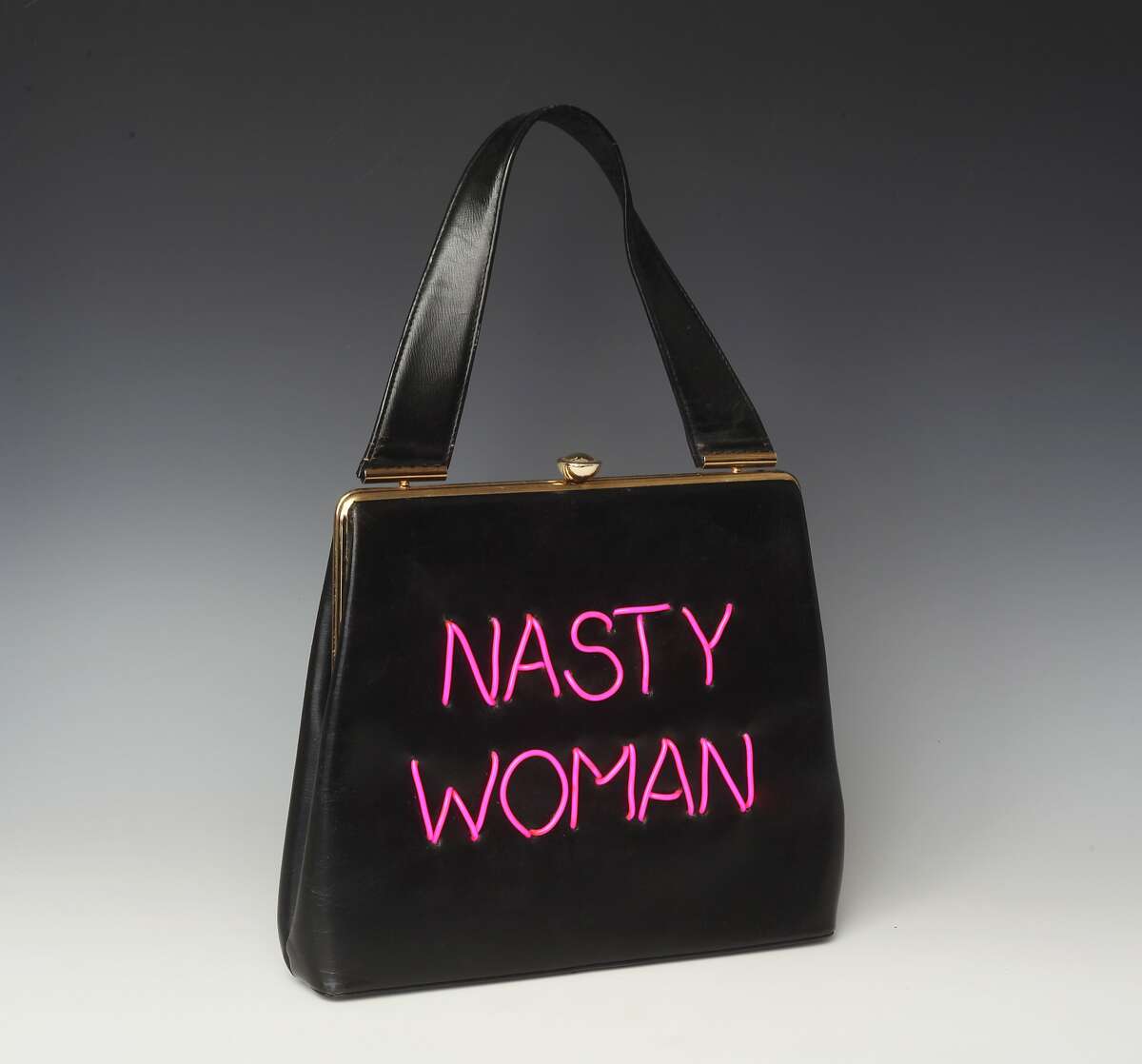 Michele Pred, a Berkeley artist, is making political statements with her Power of the Purse, a series of vintage handbags that incorporate meaningful, timely political messages. �Nasty Woman,� �Me Too,� and �My Body, My Business� are some of the phrases created using electroluminescent wire that are sewed on the purses. The series is limited edition, with only 10 made with each message.