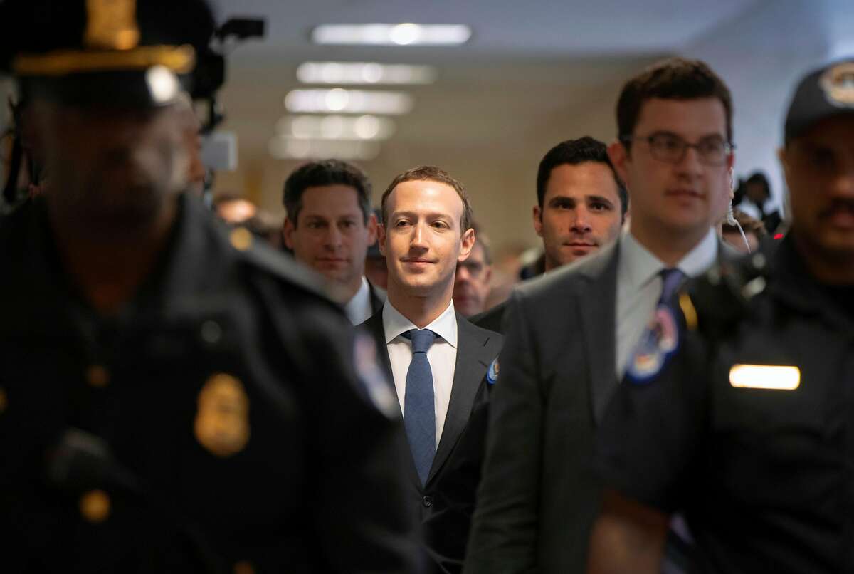 Facebook CEO Mark Zuckerberg arrives on Capitol Hill in Washington, Monday, April 9, 2018. Zuckerberg testified Tuesday before a joint hearing of the Commerce and Judiciary Committees about the use of Facebook data to target American voters in the 2016 election. (AP Photo/J. Scott Applewhite)