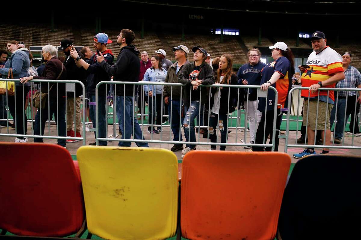 People look at Astrodome memorabilia, including the stadium seats, during Domecoming, an event celebrating the 53rd anniversary of the Astrodome, Monday, April 9, 2018 in Houston.