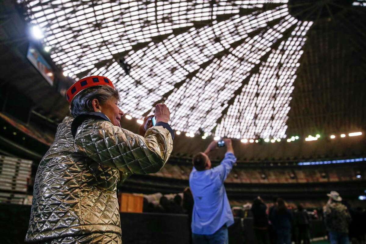 Barbara Hauser, who attended opening day at the Astrodome, wears a Spacette uniform as she takes a photo during Domecoming, an event celebrating the 53rd anniversary of the Astrodome, Monday, April 9, 2018 in Houston.