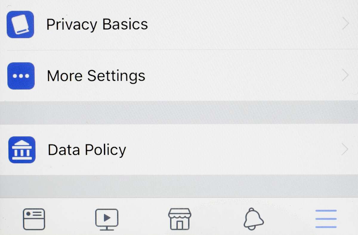 Tabs on a Facebook app for, "Privacy Basics, More Settings, and Data Policy," are displayed on an iPhone, Monday, April 9, 2018, in New York. Facebook is in full damage-control mode following revelations that it might have shared the data of some 87 million users with Cambridge Analytica. Starting Monday Facebook will let users know if their data was shared, and some 2.2 billion Facebook users will be given access to a link to see what apps they use and what information they shared with those apps. (AP Photo/Mark Lennihan)