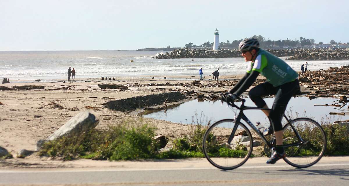 A cyclist rides along East Cliff Drive in Santa Cruz.