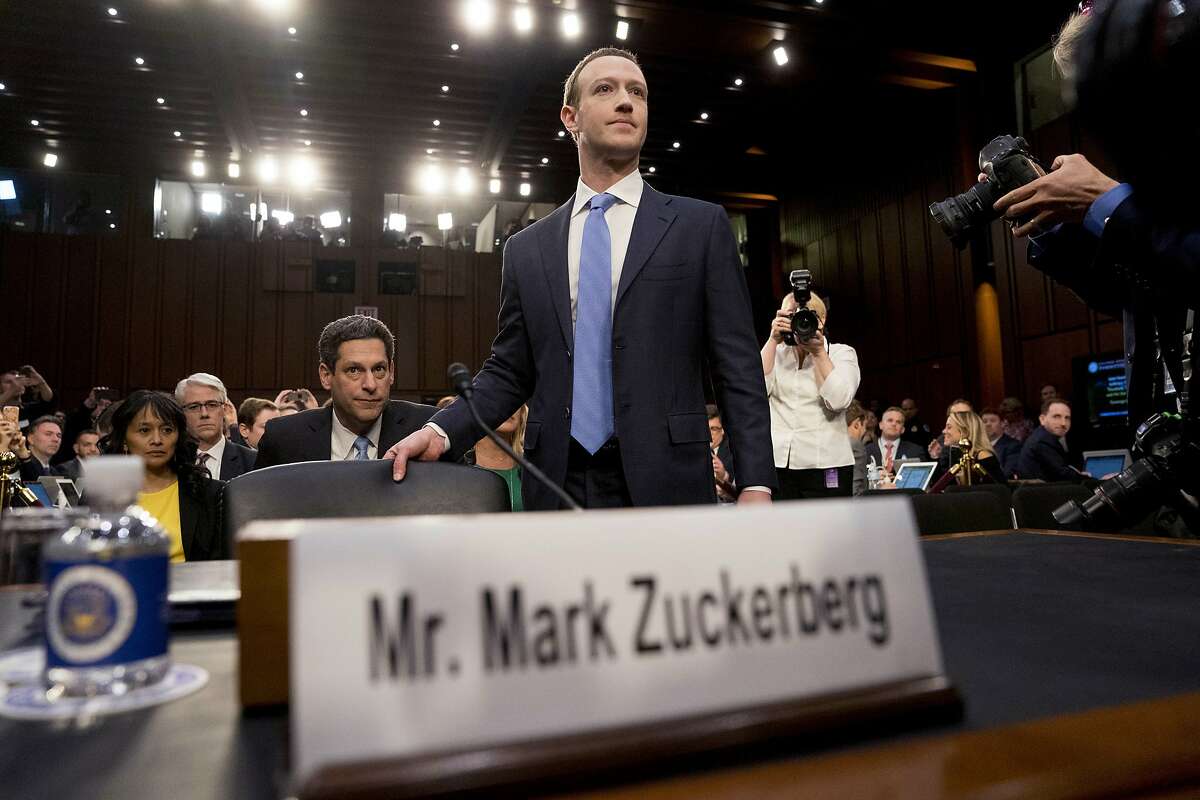 Facebook CEO Mark Zuckerberg arrives to testify before a joint hearing of the Commerce and Judiciary Committees on Capitol Hill in Washington, Tuesday, April 10, 2018, about the use of Facebook data to target American voters in the 2016 election. (AP Photo/Andrew Harnik)