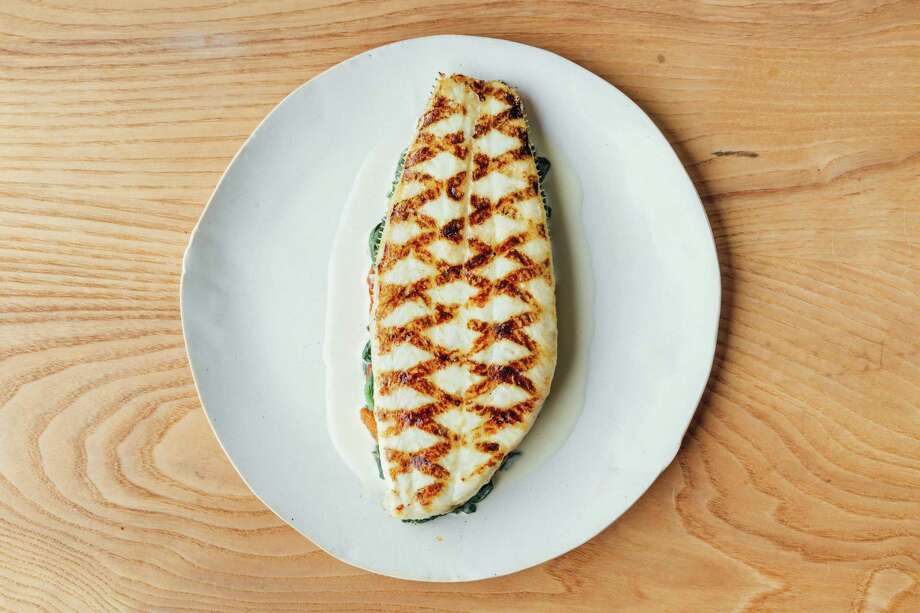 grilled fillet of dover sole with spinach, wild mushrooms and a