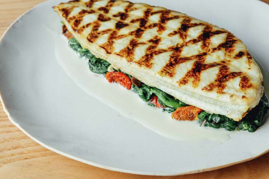 grilled fillet of dover sole with spinach, wild mushrooms and a