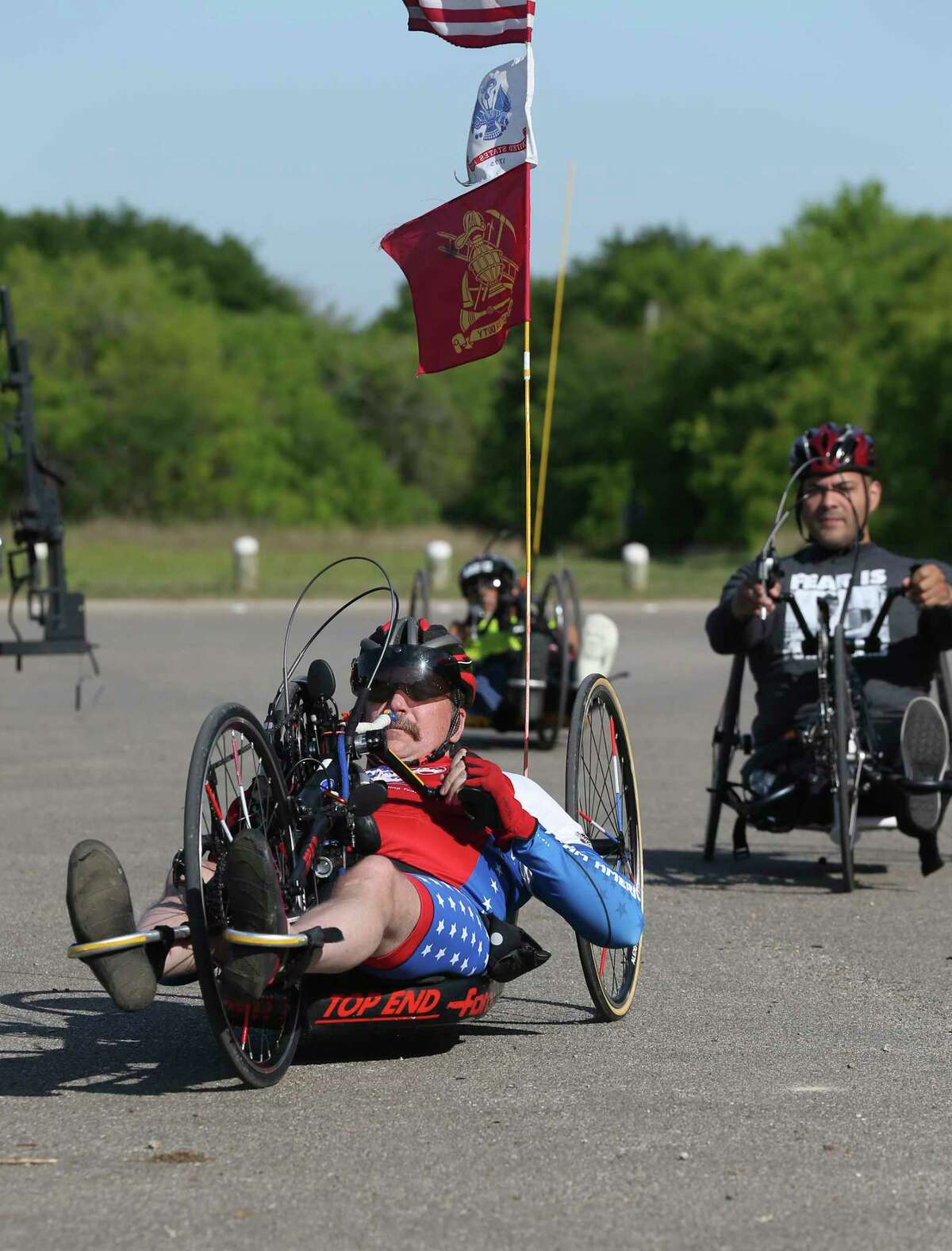 James Madison, 50, participates in a three-day cycling camp for wounded, ill and injured service members and veterans at McAllister Park, Tuesday, April 10, 2018. South Texas VA Recreation Therapy Service partnered with Operation Comfort to host it. The camp started on Monday and provided them an opportunity to ride adaptive cycles to meet their disability. For many, riding a standard bicycle is difficult due to neurological or physical injuries that affect balance and/or mobility. Therapists have found cycling benefits include improved fine motor skills, increased immune system activity, reductions in blood pressures, pain, social anxiety and it also prevents social isolation and depression. Operation Comfort also host weekly bicycle rides on Wednesday.