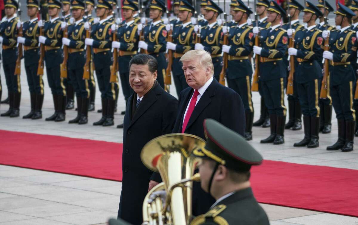 President Donald Trump and President Xi Jinping of China at a welcome ceremony in Beijing, Nov. 9, 2017. Xi April 10, 2018, portrayed China as committed to opening its economy as he presented an alternative vision to Trump’s calls for tariffs and restricting trade with China, urging “dialogue rather than confrontation.”