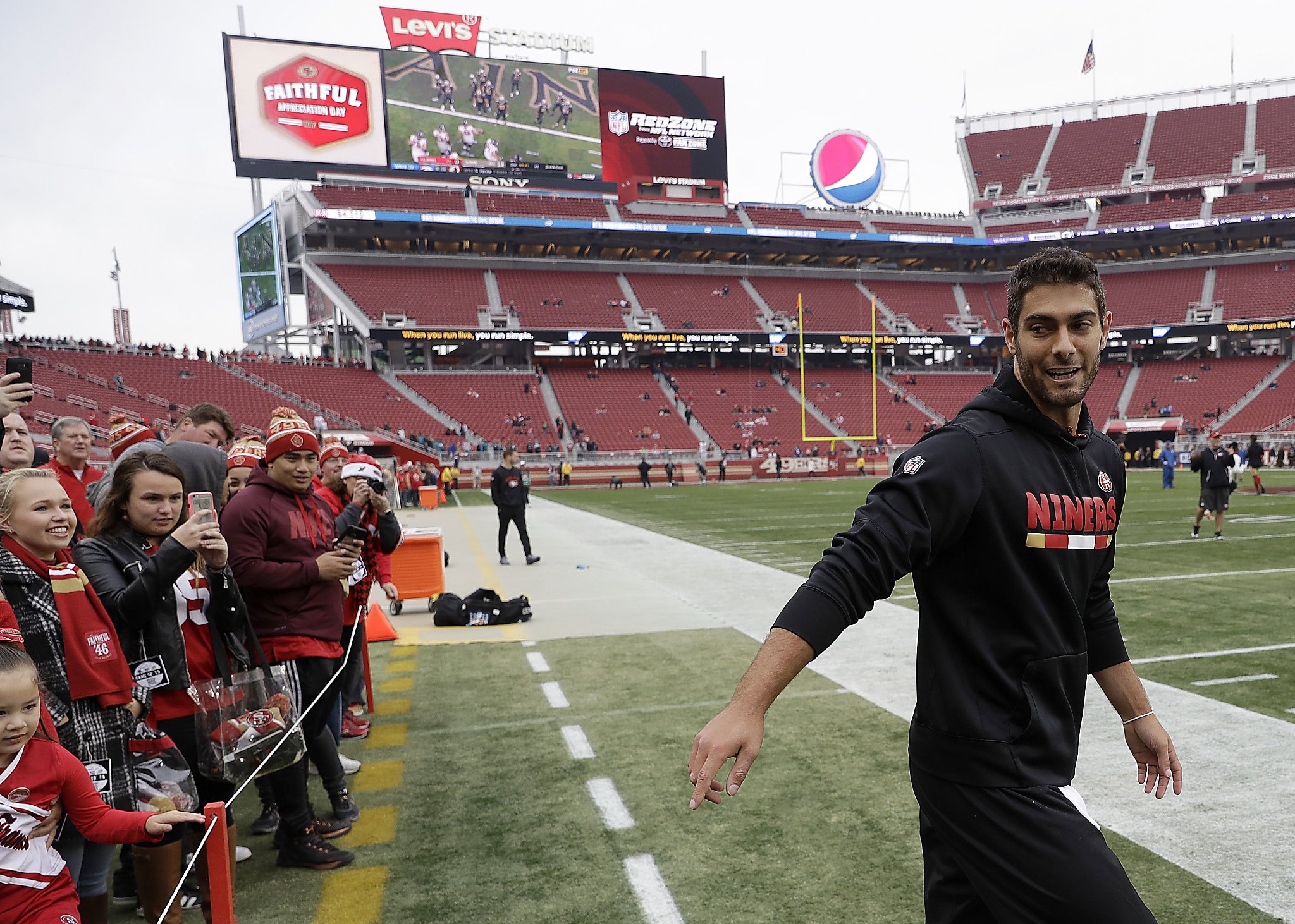 San Francisco 49ers quarterback Jimmy Garoppolo (10) warms up before an NFL  football game against the New York Giants in Santa Clara, Calif., Sunday,  Nov. 12, 2017. (AP Photo/Marcio Jose Sanchez Stock