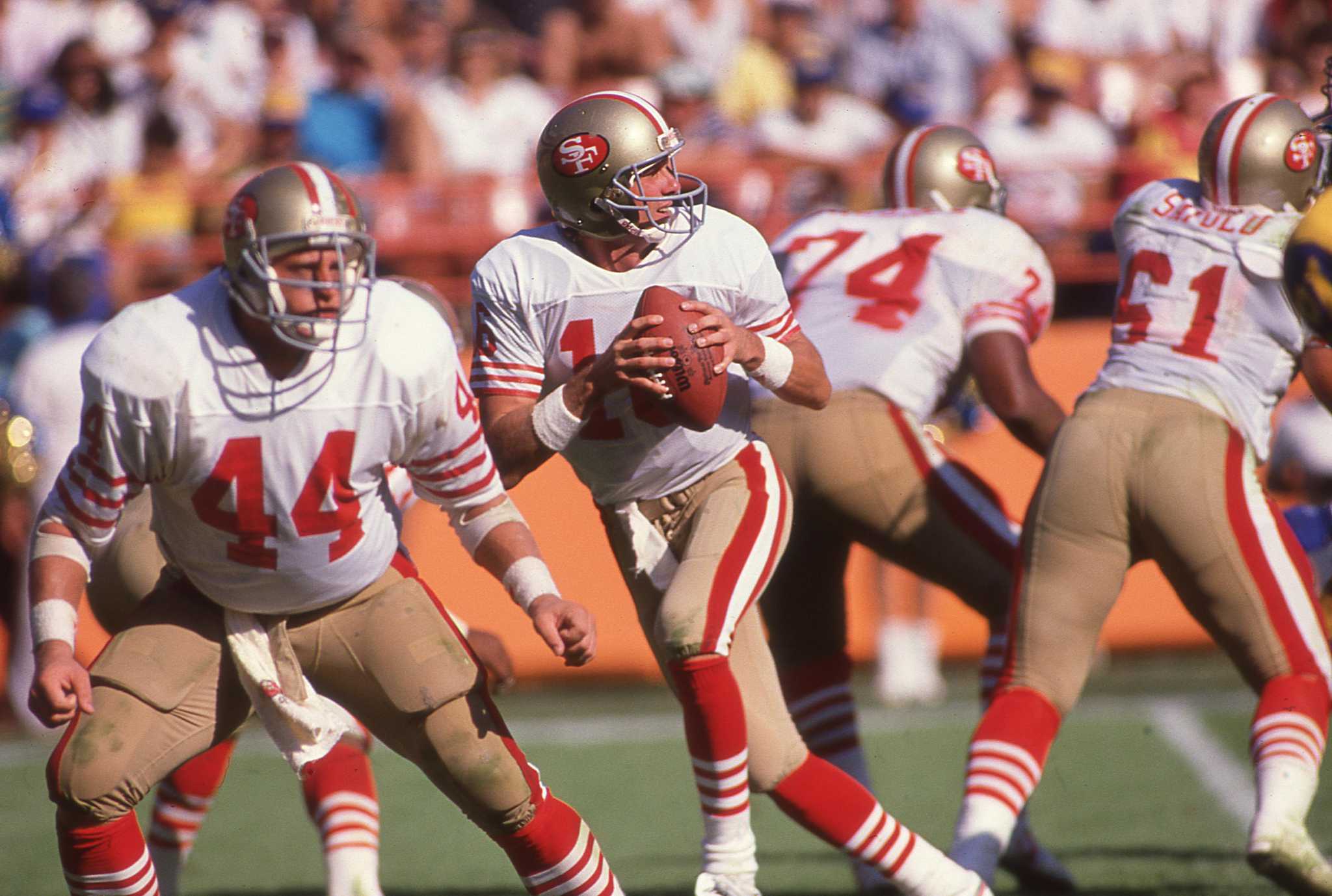 1980's: Quarterback Joe Montana #16 of the San Francisco 49ers