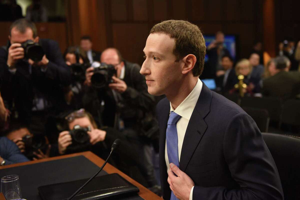 Facebook founder Mark Zuckerberg waits for a Senate committee hearing in Washington, D.C., to begin Tuesday.