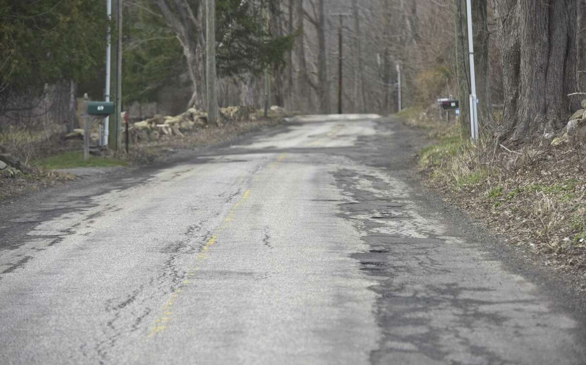 Squire Hill Road in New Milford is slated to be repaired after residents on Monday approved a $6 million bond to pay for the work.