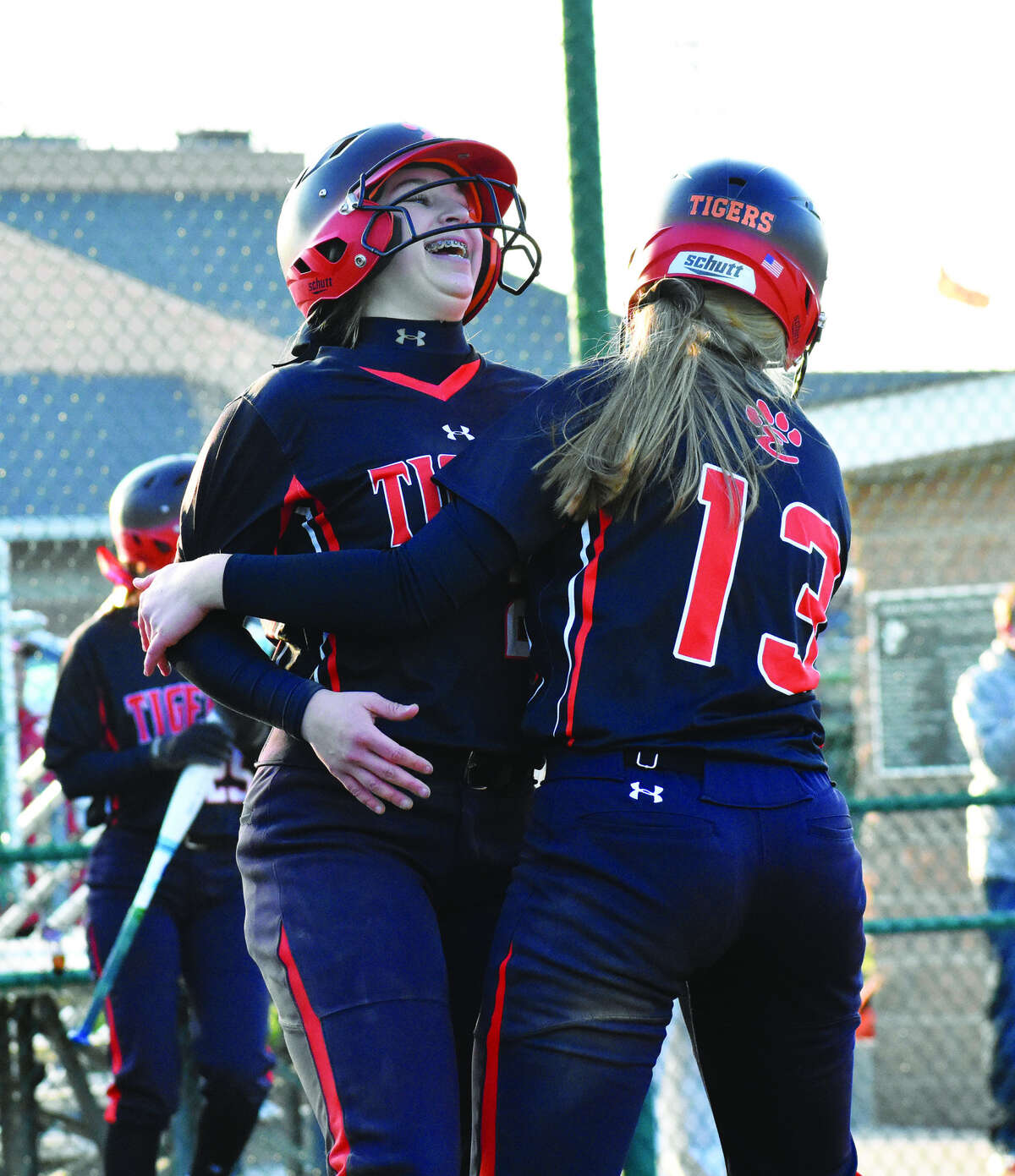 Lexi Gorniak, left, and Katherine Bobinski-Boyd celebrate after scoring on Brooke Webber’s double in the 10th inning on Tuesday.