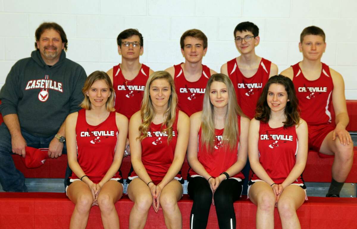 Members of the Caseville varsity track team are (front row from left) Elizabeth Robinson, Shania Drake, Olivia Speare and Becca Morgan (back) coach Dru Leppek, Chance Shippey, Brandon Lecznar, Brodey Miller and Jacob Speare. Missing are Pinkney Barrios, Andrew Bond, Louise Barrios, Briana Kzinowek, Isabelle Baker, Lyssa Tucker and Sidney Popp.