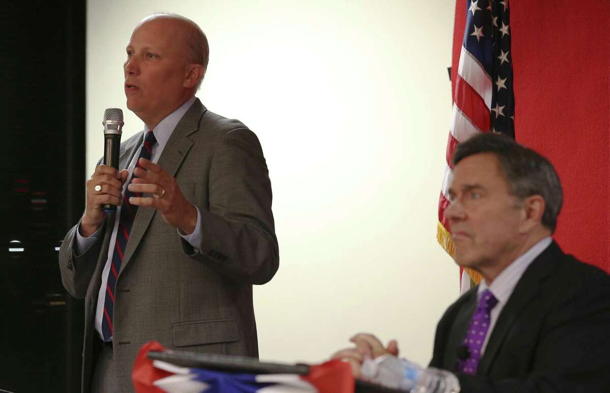 Chip Roy (left), former chief of staff to Ted Cruz, answers a question Tuesday evening during a debate sponsored by the local chapter of the Texas Young Republicans and moderated by Chris Marrou (right). About 100 people attended the debate held at Bexar County Republican Party headquarters.