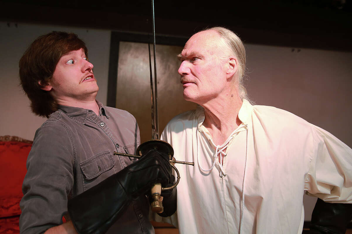 Andrew tries his best to face off with a boisterous Barrymore in a scene from "I Hate Hamlet" produced by Theatre Southwest. From left are Matt Prideaux and John Stevens.