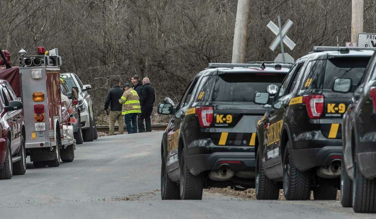 Representatives from Homeland Security, Saratoga County Sheriff Mike Zurlo and fire are scene near a line of law enforcement vehicles near where a device that looked like a pipe bomb was located near Zepko Road Wednesday April 11, 2018 in Ballston Spa, N.Y. (Skip Dickstein/Times Union)