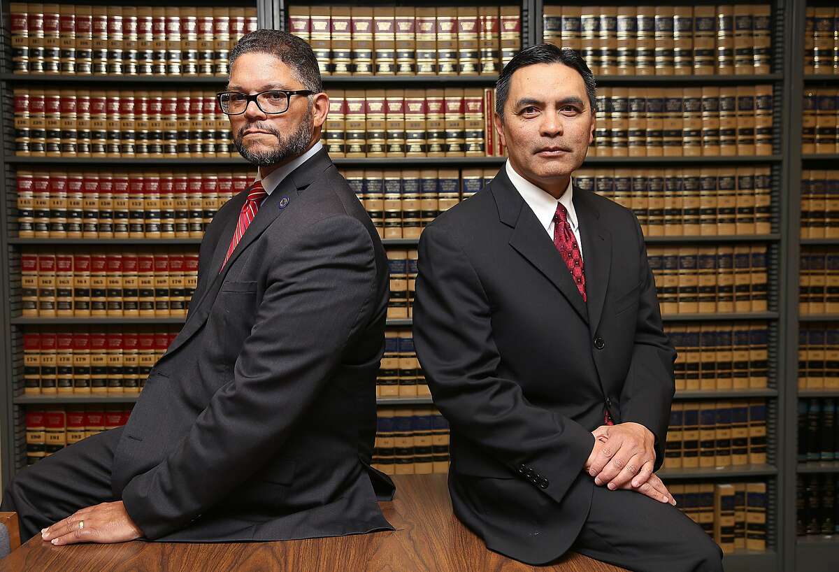 Department of Motor Vehicles chief counsel Brian Soublet (left) and DMV deputy director Bernard Soriano (right) sit in the law library at the California DMV and on Friday, April 6, 2018, in Sacramento, Calif.