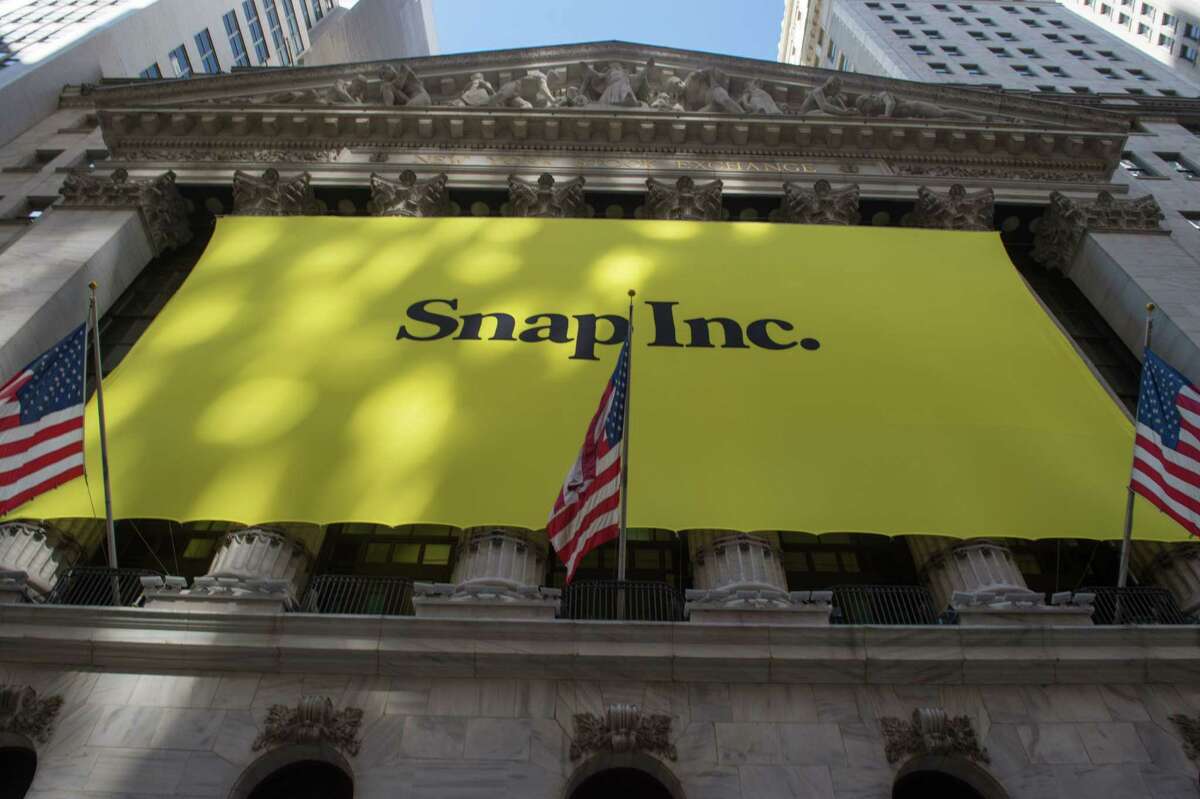 (FILES) This file photo taken on March 2, 2017 shows a Snap Inc. banner covering the facade of the New York Stock Exchange in New York. Snapchat parent Snap Inc. disclosed on November 8, 2017 that Chinese tech giant Tencent had taken a 12 percent stake, in a sign of confidence in the social network which has delivered disappointing results since its share offering this year.A securities filing showed Tencent Holdings had purchased some 146 million shares of Snap non-voting stock in open market purchases in November. / AFP PHOTO / Bryan R. SmithBRYAN R. SMITH/AFP/Getty Images