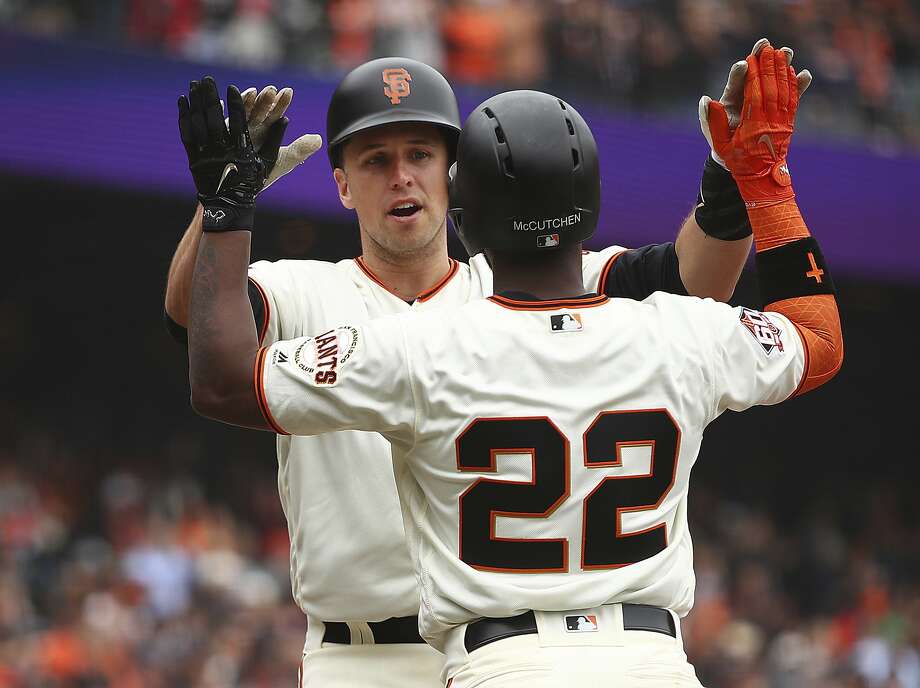 francisco giants buster posey, left, is congratulated by andrew