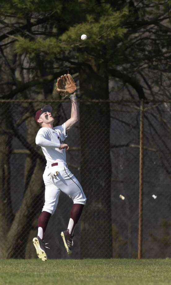 Bethel's Tyler Davis (4) goes back for the catch in the outfield during the boys baseball game between New Milford and Bethel high schools, Wednesday afternoon, April 11, 2018, at Bethel High School, Bethel, Conn. Photo: H John Voorhees III / Hearst Connecticut Media / The News-Times
