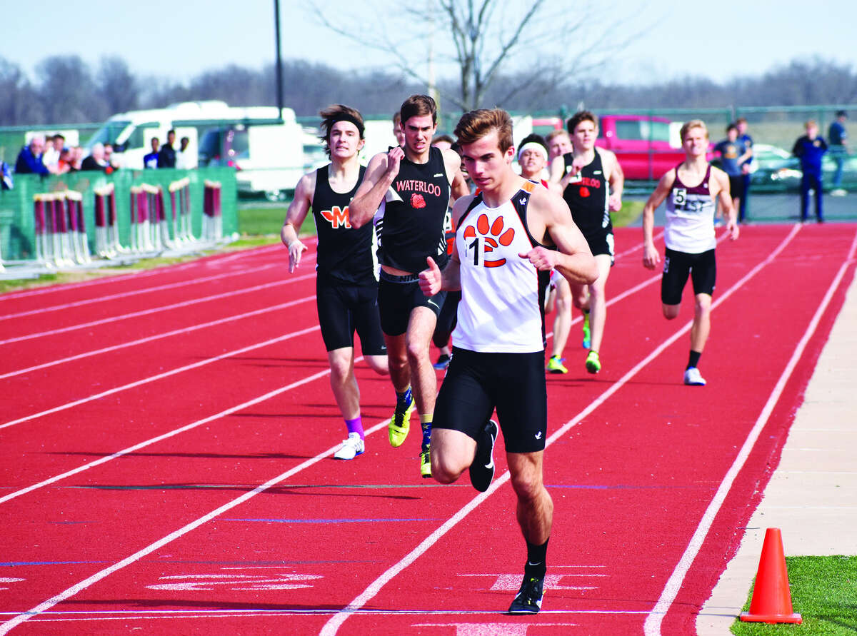 Edwardsville senior Franky Romano crosses the finish line in first place of the 800-meter run at the Belleville West Norm Armstrong Invitational earlier this season.