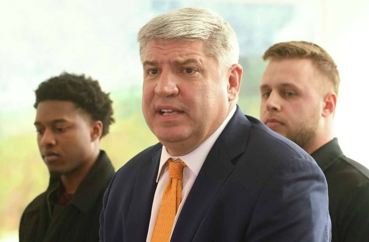 Siena men's basketball coach Jimmy Patsos holds a news conference at Lombardi, Walsh, Davenport, Amodeo law firm to address reports that he verbally abused a team manager on Friday, April 6, 2018 in Colonie, N.Y. Former team managers Wesley Douglas, left, and Robert Sherlock stand behind him. (Lori Van Buren/Times Union)