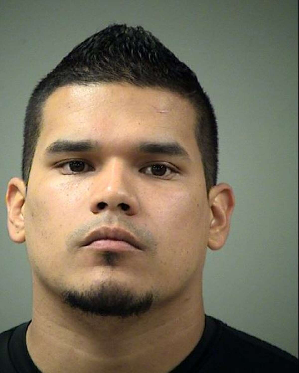 Former Bexar County Deputy Michael Gomez, 30, seen in a booking photo, was indicted Wednesday on a charge of official oppression, the sheriff announced. Gomez is one of two deputies accused of assaulting an inmate on June 6 at the Bexar County Jail.