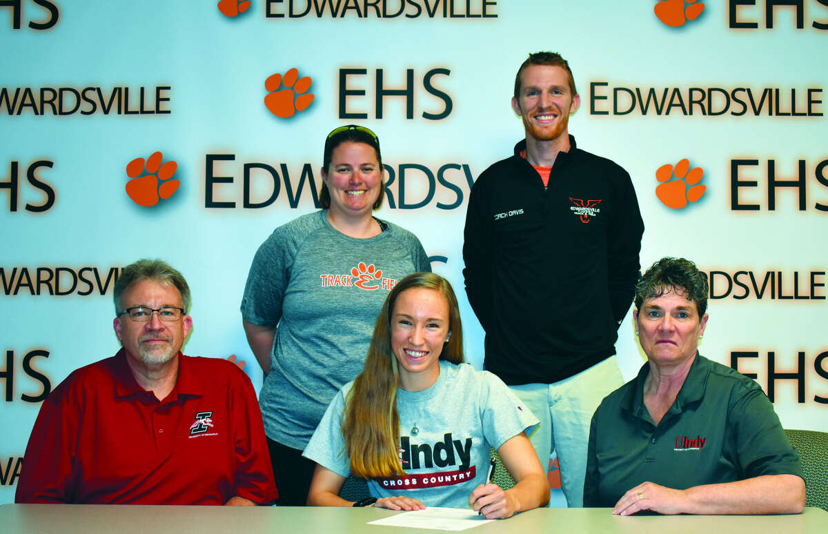 Pictured is EHS senior Melissa Spencer, center, with parents Steve and Joanne. Standing are EHS coaches Camilla Eberlin, left, and Dustin Davis.