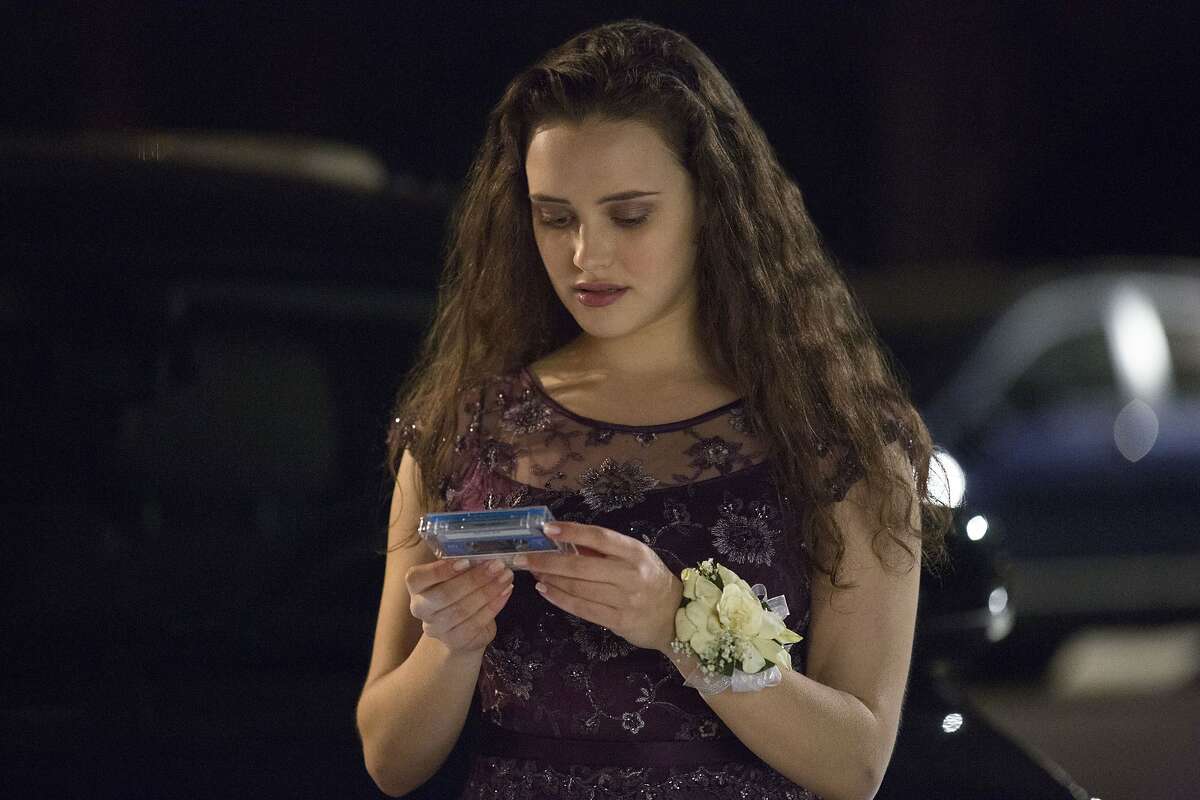 FILE - This file image released by Netflix shows Katherine Langford as Hannah Baker in a scene from the series, "13 Reasons Why." The popular TV series about Baker's suicide that showed her ending her life may have prompted a surge in online searches for suicide, including how to do it, according to a new study published Monday, July 31, 2017, in JAMA Internal Medicine. (Beth Dubber/Netflix via AP, File)