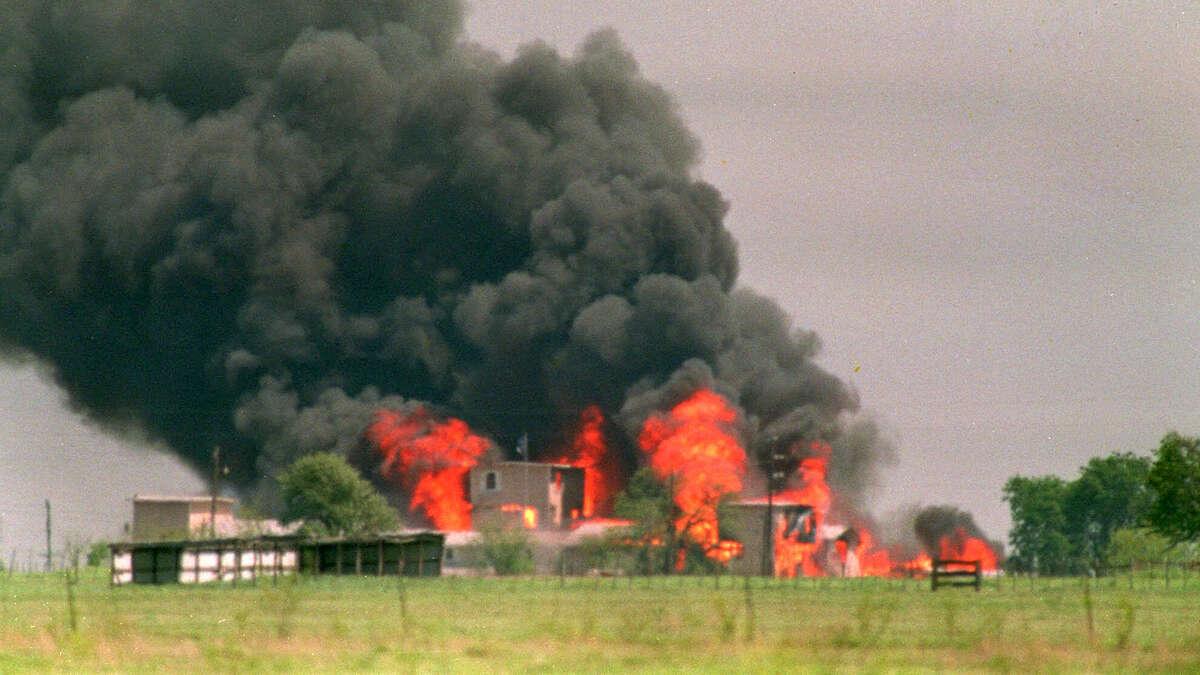 The Branch Davidian compound near Waco, Texas, is shown engulfed by flames in this April 19, 1993, file photo. (AP Photo/Susan Weems, File).