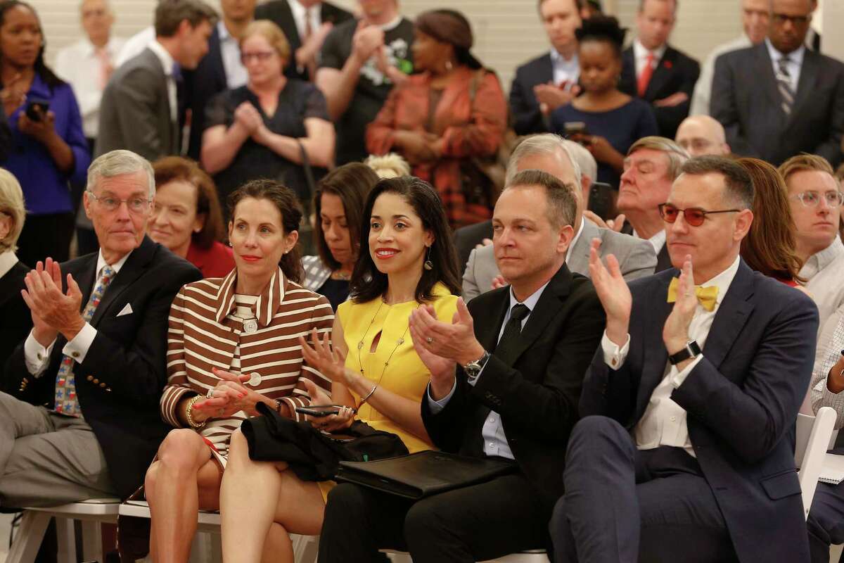 Dignitaries and guest applaud after hearing the plans for Houston's Midtown innovation district in a news conference Thursday morning at the historic Sears building Thursday, April 12, 2018, in Houston.
