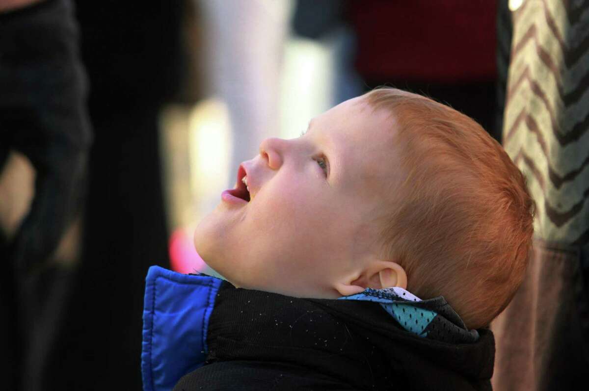 Kevin Orlick, 4, of Trumbull, gazes up at the Ferris Wheel during the annual Trumbull Rotary Carnival at Hillcrest Middle School in Trumbull on Wednesday.The carnival, which raises money for service projects and grants continues through Sunday.