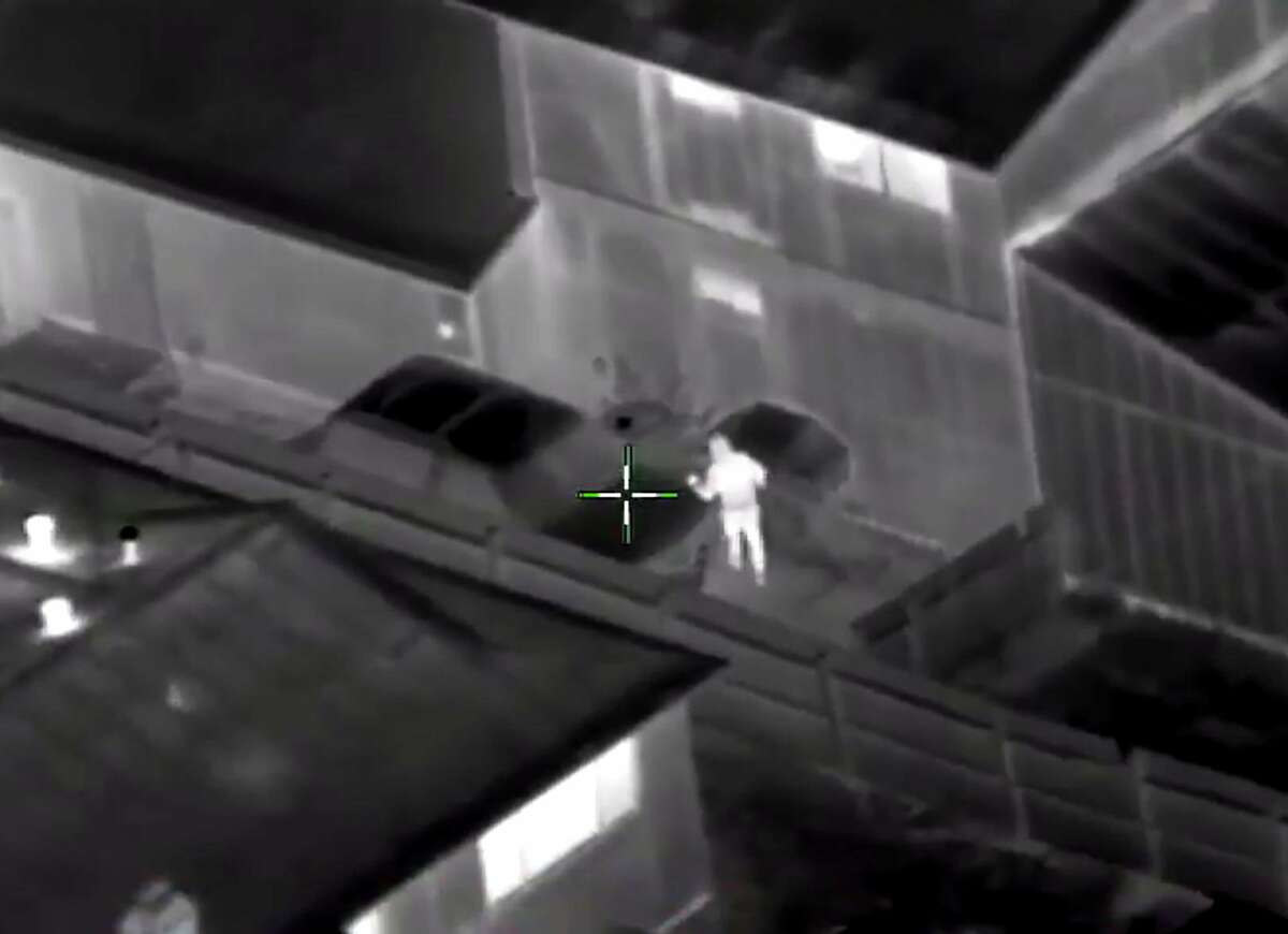 Screenshot of a video of Stephon Clark shooting where officers fatally shot the unarmed black man who was holding his cellphone in his grandparents' backyard. The Sacramento Police Department has released helicopter (Sacramento Police Department)