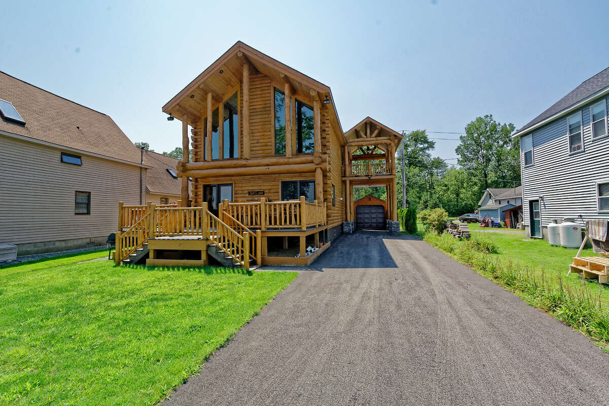 The log cabin at 104 Riley Cove Rd. on Saratoga Lake in Malta sold for $10,000 above its $700,000 asking price after some negotiations to include the dock.