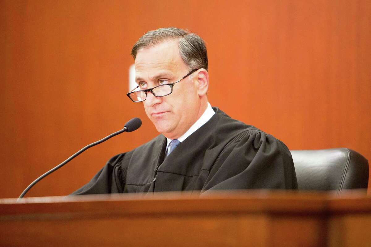Superior Court Judge Thomas Moukawsher reads a 254-page ruling on an 11-year-old lawsuit Connecticut Coalition for Justice in Education Funding v. Rell, Sept. 7, 2017 at the Hartford Superior Court. Moukawsher is hearing this year litigation filed by Connecticut cities and towns against pharmaceutical companies including Purdue Pharma.
