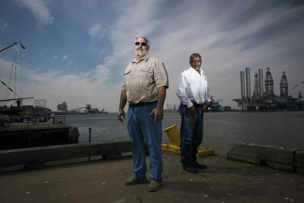 Federally licensed pilots, Capt. Jay Heichelheim, left, and Capt. Graylin Gant stand at Pier 21 near where ships dock in Galveston, Thursday, March 8, 2018. Heichelheim and Gant are part of a lawsuit attempting to authorize a second state-licensed pilot group to guide ships to Galveston and Texas City docks. ( Marie D. De Jesus / Houston Chronicle )