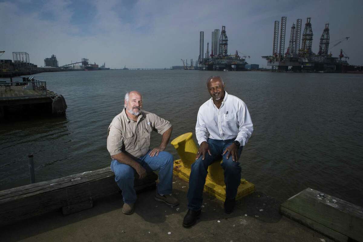 Federally licensed pilots, Capt. Jay Heichelheim, left, and Capt. Graylin Gant sit at Pier 21 near where ships dock in Galveston, Thursday, March 8, 2018. Heichelheim and Gant are part of a lawsuit attempting to authorize a second state-licensed pilot group to guide ships to Galveston and Texas City docks. ( Marie D. De Jesus / Houston Chronicle )