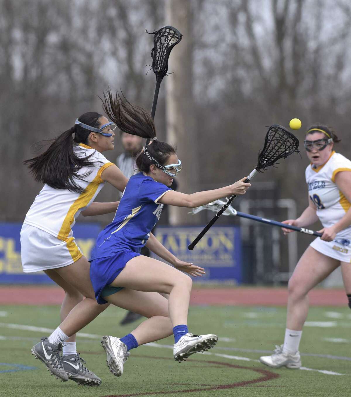 Newtown's Hana Rosenthal (3) and Brookfield's Eliza Lloyd (9) collide in the girls lacrosse game between Newtown and Brookfield high schools, Thursday afternoon, April 12, 2018, at Brookfield High School, in Brookfield, Conn.