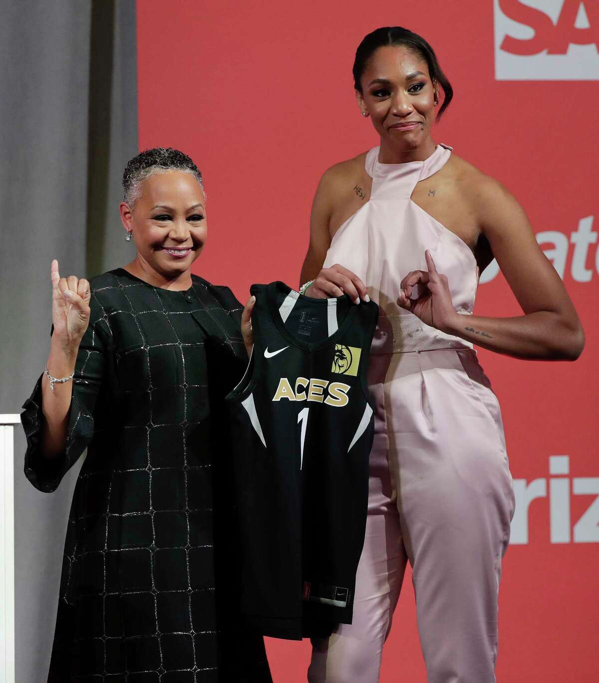 South Carolina's A'ja Wilson, right, poses for a photo with WNBA President Lisa Borders after being selected as the No. 1 overall pick by the Las Vegas Aces in the WNBA basketball draft, Thursday, April 12, 2018, in New York. (AP Photo/Julie Jacobson)