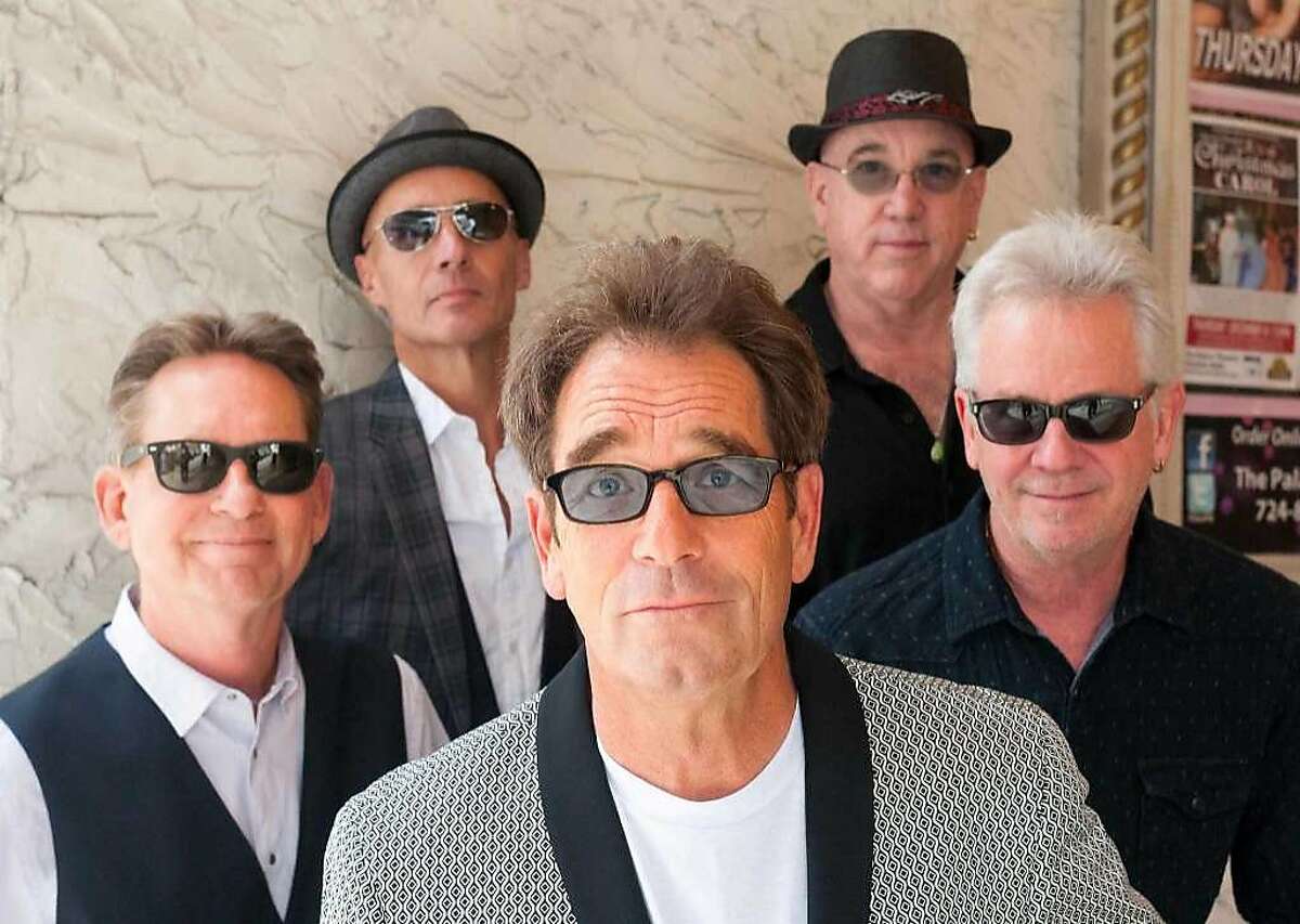 Huey Lewis, center, and The News