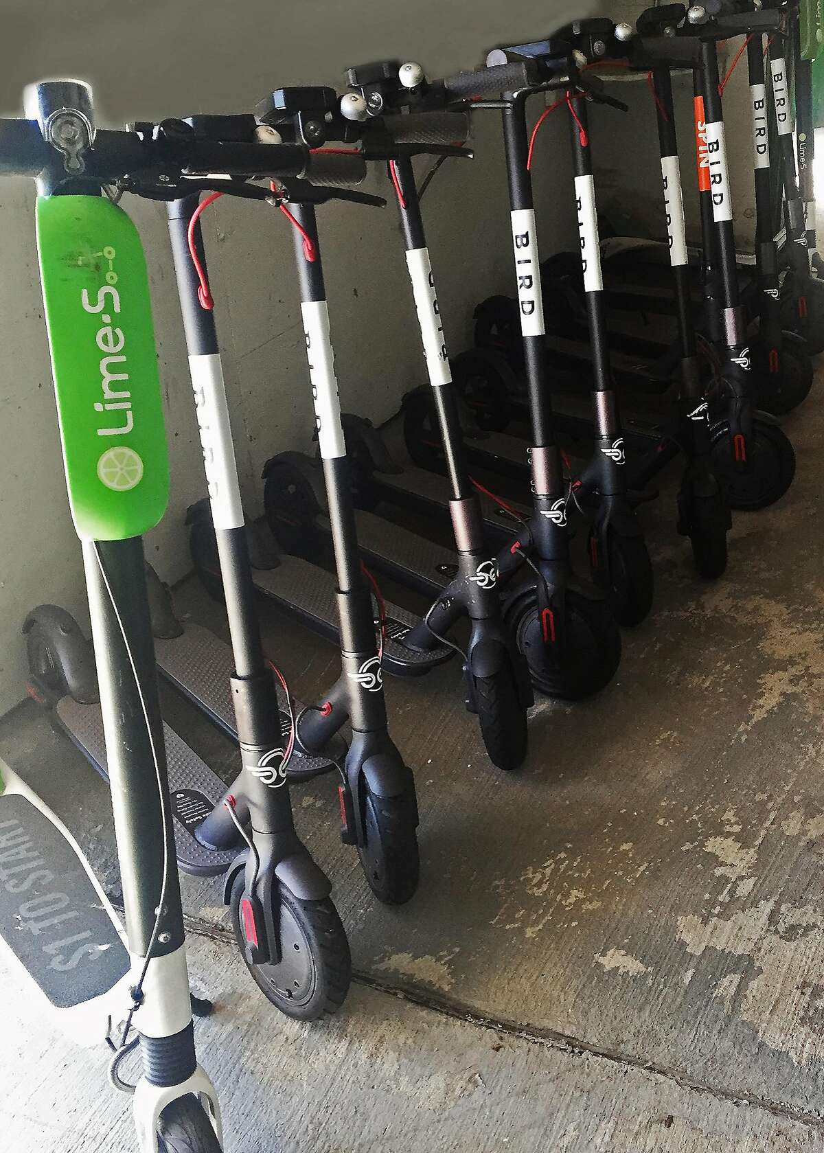 Confiscated scooters are seen at a San Francisco Department of Public Works storage facility on Friday, April 13, 2018 in San Francisco, Calif.