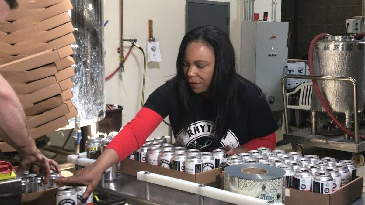 Pictured: Alisa Bowens-Mercado hold a six-pack of beer from her brewery, Rhythm Brewing Co. In response to the support she is getting, Bowens-Mercado is donating a portion of proceeds from online sales to Black Lives Matter New Haven. She is calling it "The Great Donate." "We have hit a time when now we're talking about it. We've been saying it as owners and fighting the good fight for economic justice for our industries. Now people are getting it," she said. "We are getting just as many people not of color ordering and purchasing and donating to Black Lives Matter." Supporting Black-owned businesses is another form of protest, said Young. It’s a way to get the Black community to where it wants to be. “The black folks that I know really want America to succeed. It’s not fun having to always complain, we just want fairness.” 