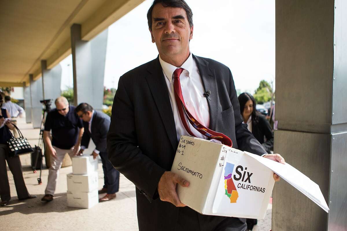 Venture capitalist Tim Draper delivers signed petitions to divide California into six separate states at the County of Sacramento Voter Registration and Elections Department in Sacramento, California, July 15, 2014.