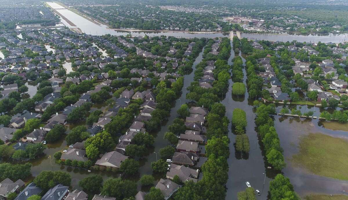 Homes in the Cinco Ranch area are surrounded by water from Barker Reservoir, Saturday, September 2, 2017, in Houston.