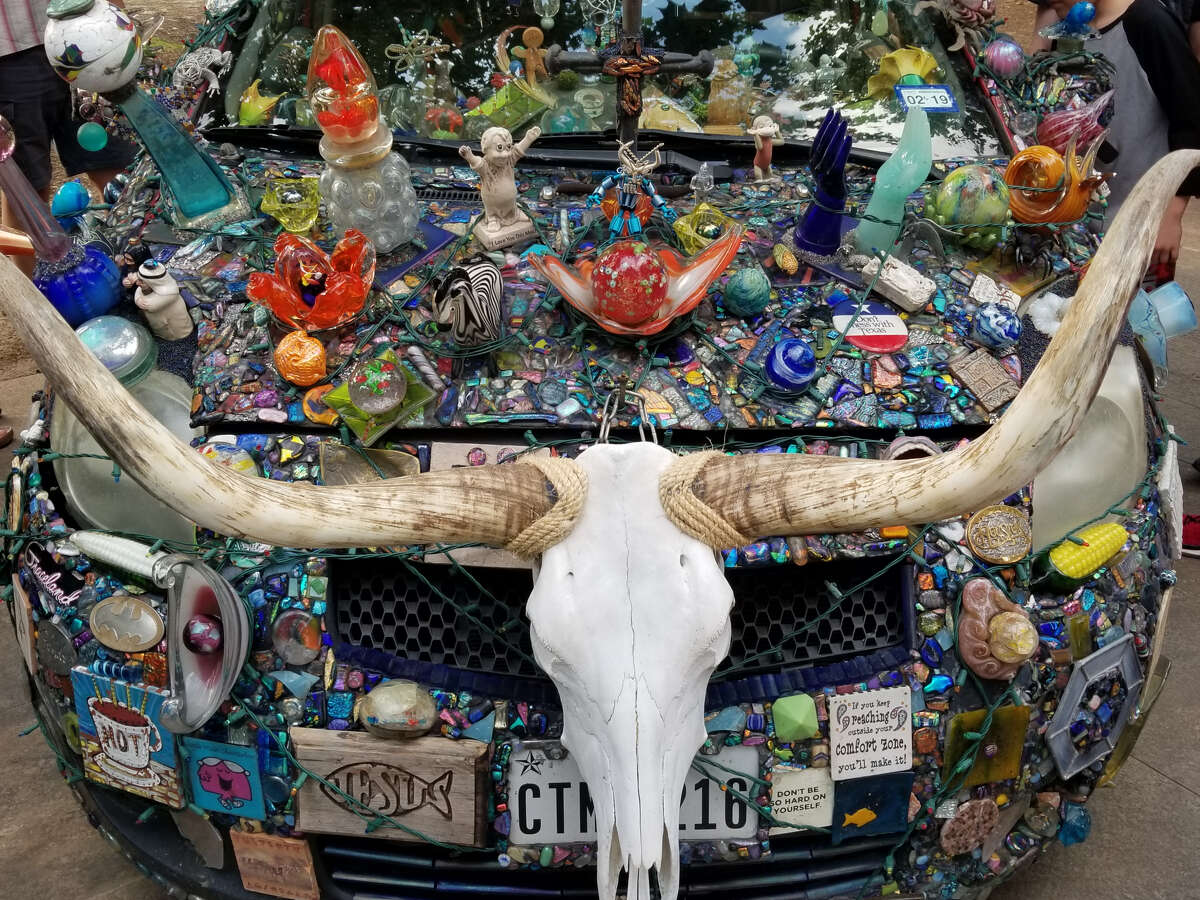 The longhorn skull adds a Texas touch to Randy Blair's glass-covered art car.
