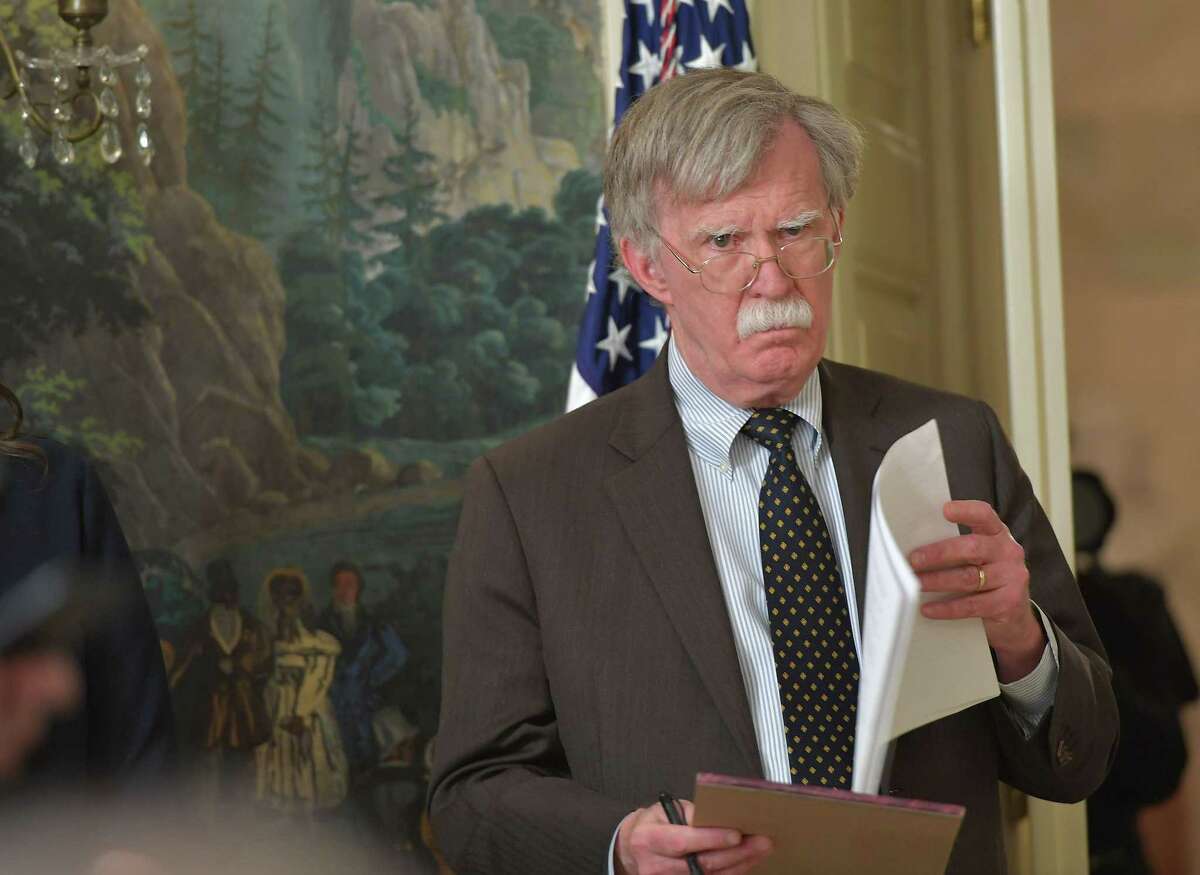 National Security Advisor John Bolton listens as US President Donald Trump addresses the nation on the situation in Syria April 13, 2018 at the White House in Washington, DC. Trump said strikes on Syria are under way. / AFP PHOTO / Mandel NGANMANDEL NGAN/AFP/Getty Images