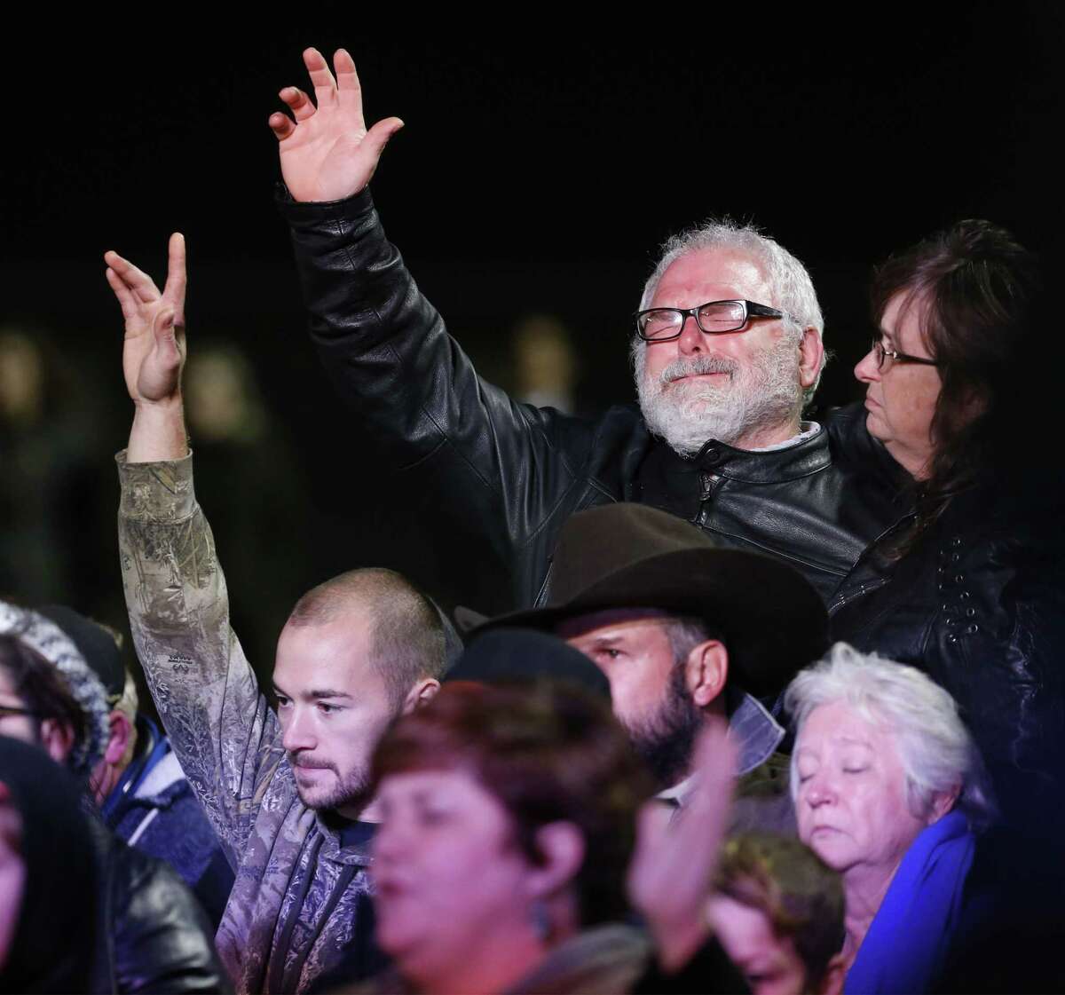 Stephen Willeford (top right) becomes emotional as he joins in prayer with the First Baptist Church families as Vice-president Mike Pence makes remarks at Floresville High School to pay respects to the victims of Sunday's church shooting at First Baptist Church in Sutherland Springs, Texas on Wednesday, Nov. 8, 2017. (Kin Man Hui/San Antonio Express-News)
