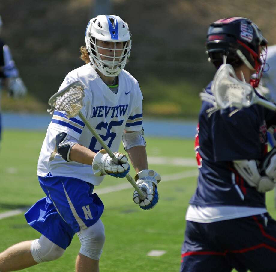 Newtown’s Andre Sokk defends during a game against Stepinac on Saturday. Photo: Ryan Lacey / Hearst Connecticut Media
