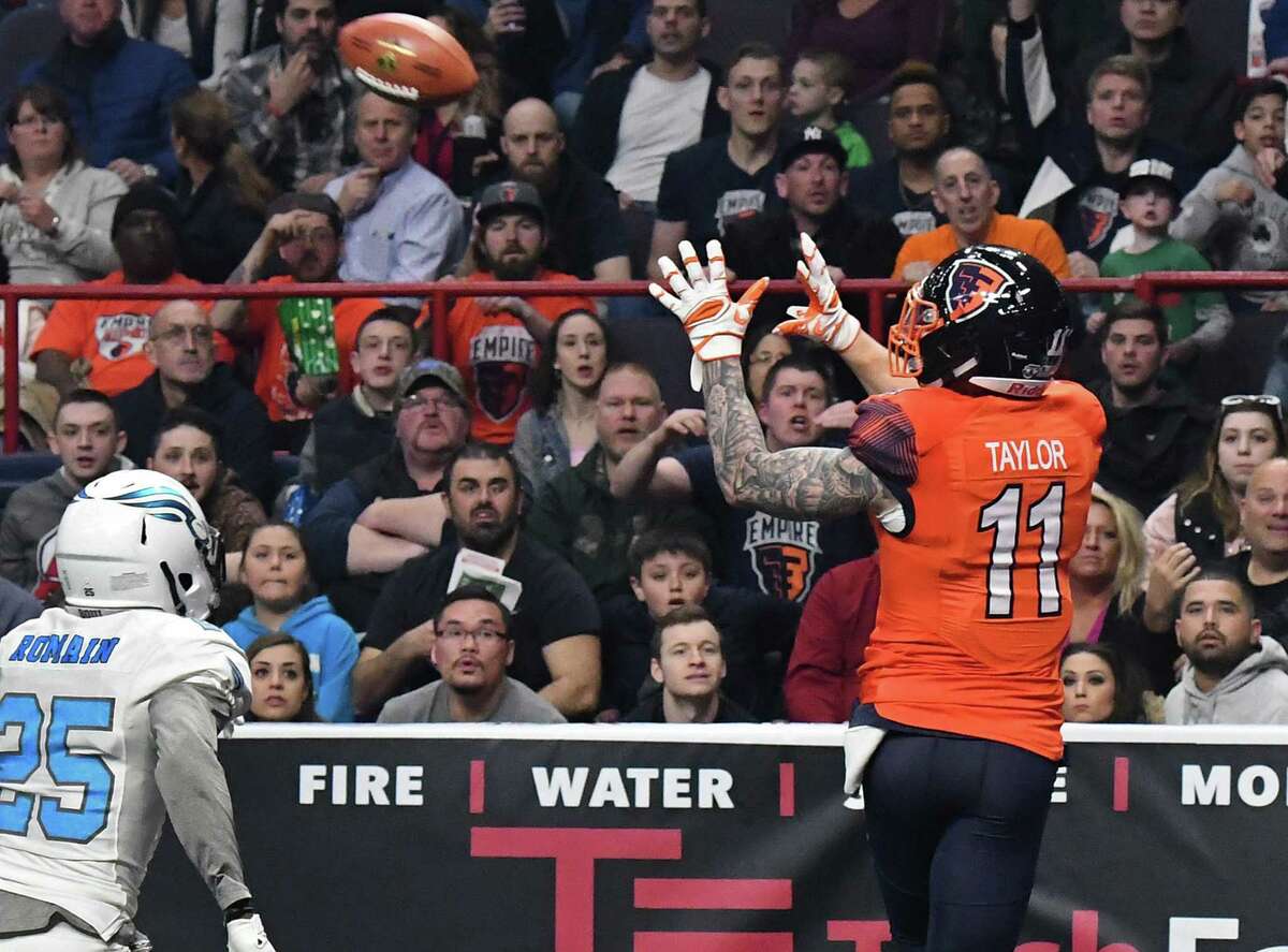 Albany Empire's #11 Collin Taylor, right, beats out Philadelphia Soul's # 25 James Romain to complete a touchdown pass in his team's Arena Football League debut at the Times Union Center Saturday April 14, 2018 in Albany, NY. (John Carl D'Annibale/Times Union)
