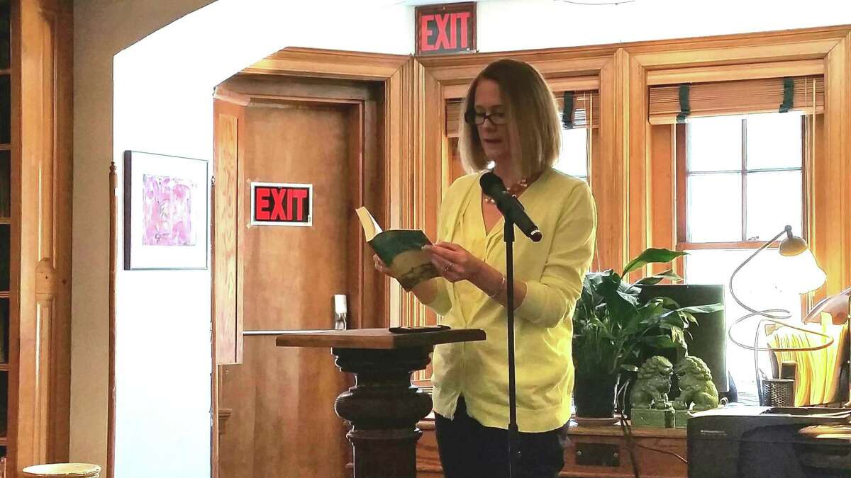 Sharon Selectwoman Jessica Fowler reads an excerpt from the novel News of the World by Paulette Jiles to an audience of 25 people at the Hotchkiss Library of Sharons Reading Jubilee on Saturday.